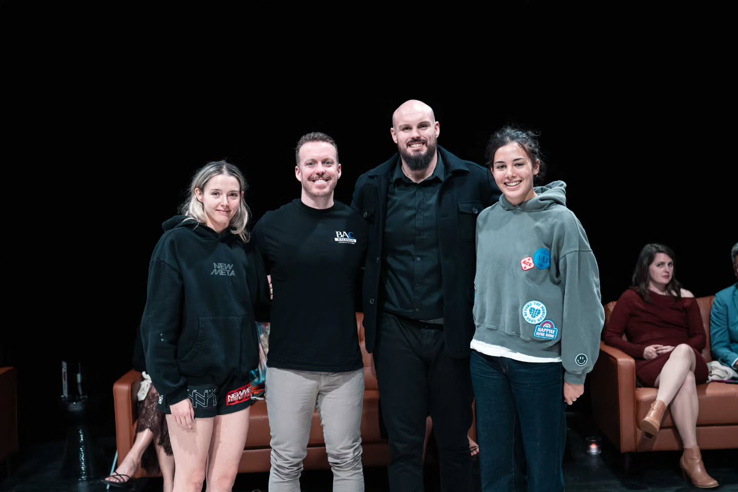 Kai Baldwin and Peter Campbell with athletes on stage at the PGF x WNG Australian Qualifier